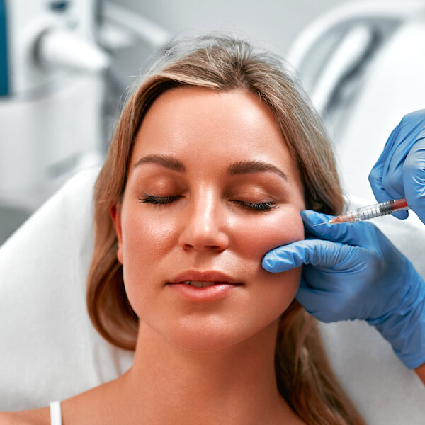 sculptra injections collagen production poly l lactic acid facial volume dermal fillers deep facial wrinkles smile lines more youthful appearance fda approved aging process deep dermis